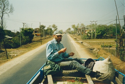 The local bus was full, riding the roof the only option