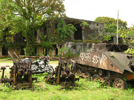 WW11 leftovers, tank, guns and bullet ridden building