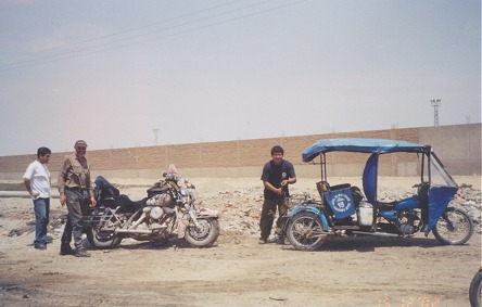 Being towed by a three wheeler, another belt broken, riding the beach