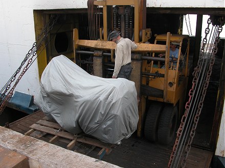 Loading the bike onto the boat, out of Sandakan Malaysia