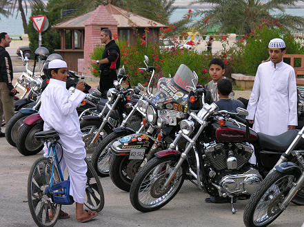 Children interested in the motorcycles at Al Khor