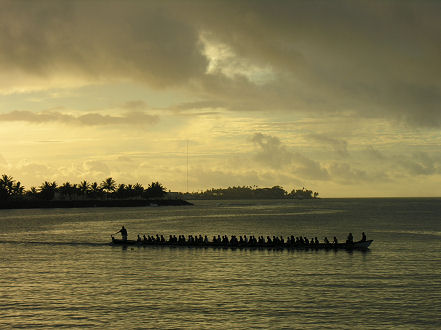 Futasi boats, practicing for the Teuila festival at sunset