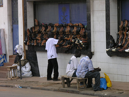 Street selling of shoes. An outside window display