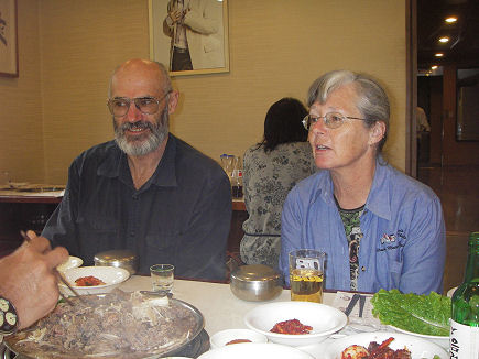 Sitting on the floor eating bulgogi with Yun-Soo and James