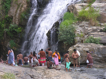 Locals enjoying a cool holiday dip at the waterfall near Ella
