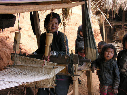 Ann lady with her children weaving