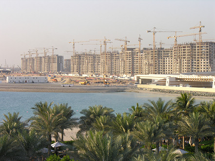 Construction cranes over Palm Islands