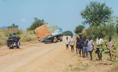 Broken axel, common with the overloaded trucks