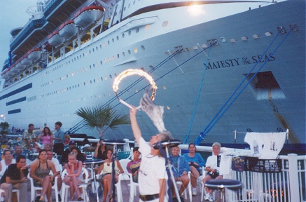 Busking with cat tricks. Cruise passengers the main audience