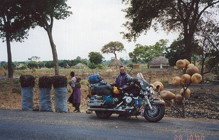 Selling charcoal and gourds roadside