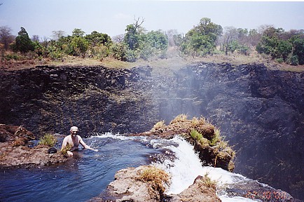 Swimming at the top of the falls
