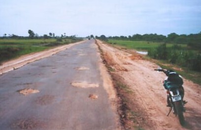 The main road into Siem Riep had bombed out sections like this.