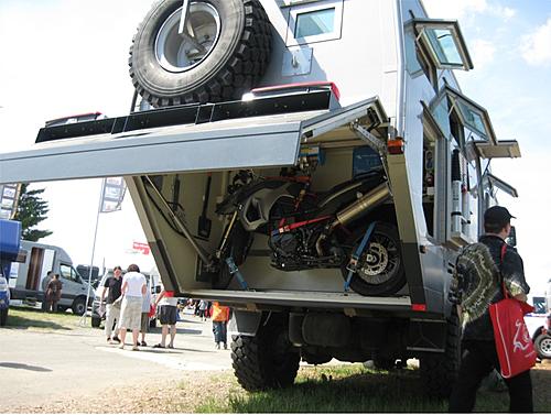 Loading a motorcycle into the rear of an expedition truck-bk-193r.jpg