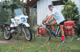 Ed Sismey on his bicycle, Poptun, Guatemala.