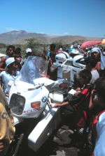 Crowd around the bike after falling into the river.