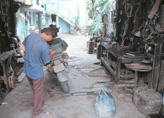 Max at repair shop, Ecuador.