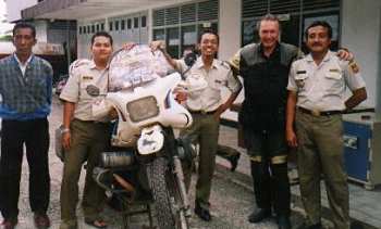 Friendly Customs people at Dumai. Plain clothes man on left was our 'personal driver'