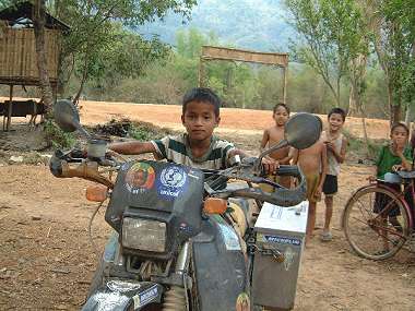 Kid sitting on Jurgen's bike.