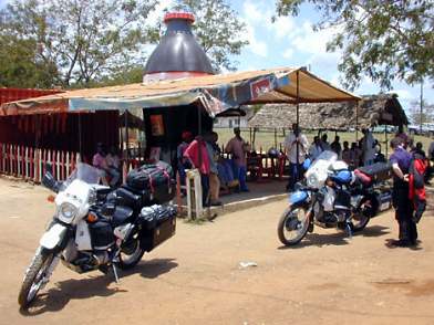 Kenya Tanzania border crossing, complete with giant coke bottle