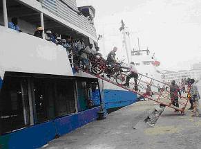 Debarking the bike from the ferry at Dar es Salaam, Tanzania.
