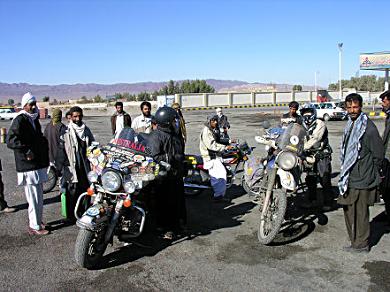 Getting petrol from drums near the border with Pakistan.