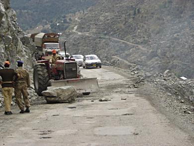 Making repairs on the Karakoram Highway, Pakistan.