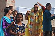  Women remove their veils to welcome us with smiling faces.