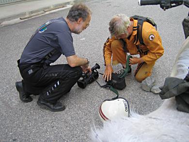 Grant and Austin preparing the camera for filming while riding!
