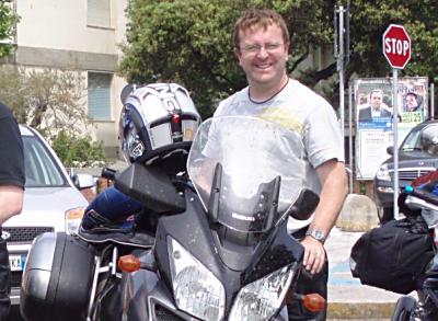 Adrian Coe with bike on 40th birthday bike trip.