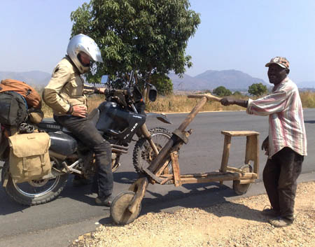 by Dennis Vloet, Netherlands. Frits Engelaer discusses greener methods of transportation in southern Angola, on Nijmegen-Cape Town tour, Yamaha XT600E.
