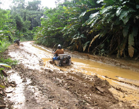 by Carrie Larose, of Brent Larose, somewhere in Guyana jungle, on two BMW F650GS's through 24 countries.