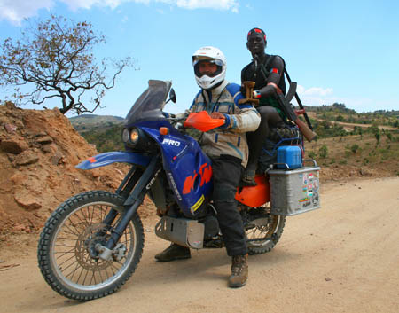 by George Guille, Channel Islands, of Veysel Bayam picking up hitch hikers in the Omo Valley, Ethiopia.