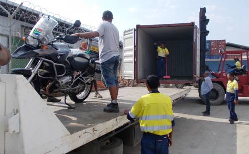 Moving the clean bike to the container.