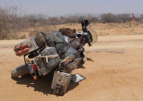 Mike with broken bike, Kenya.