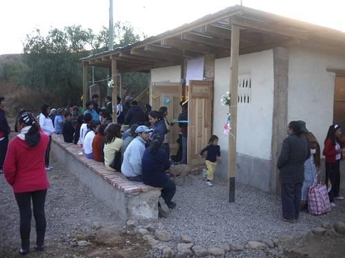 People start gathering for the 'official opening' of the Biblioteca.