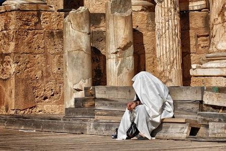 Lady praying in Leptis Magna, Libya.